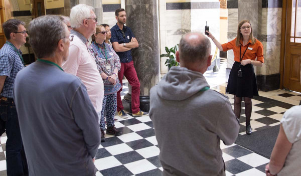 A tour guide speaks to a group of people in New Zealand's Parliament building.