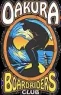 The Oakura Boardriders Club logo features retro-style artwork of a surfer carving through a towering wave, with a mountain backdrop.