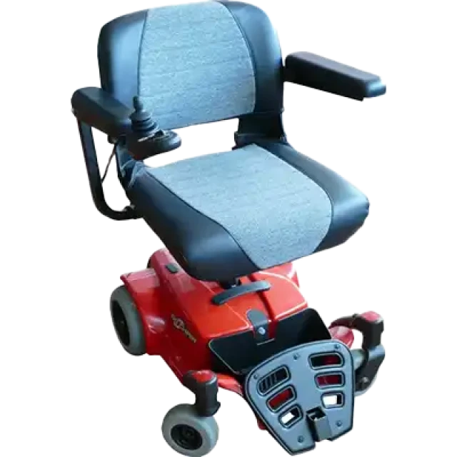 A red power wheelchair with a black seat and arm covers, and grey wheels. The wheelchair offers easy manoeuvrability and comfort, with a sleek design for everyday use.