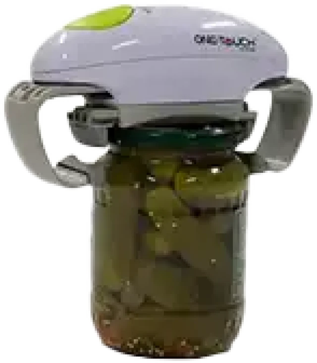 A green and white electric jar opener is positioned on top of a jar of pickles, with teal gripping bars securing the lid.