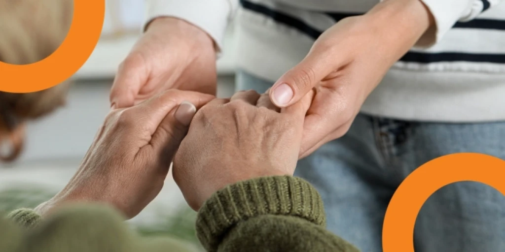 A close up on two people holding hads