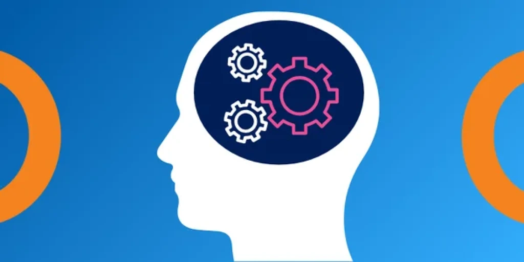 The outline of a head with cogs inside