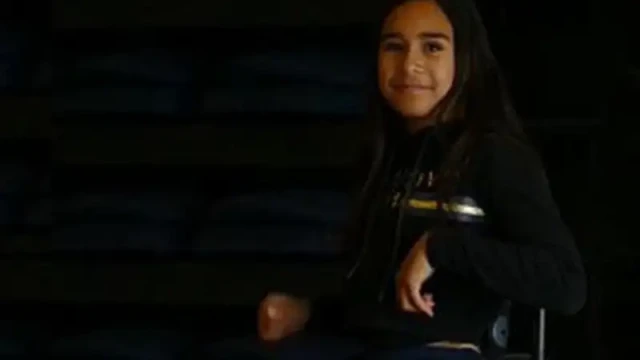 Harper is a young māori girl with long dark brown hair who uses a wheelchair