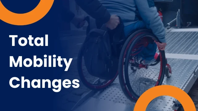 Person in a wheelchair being wheeled into the back of a mobility van. Total Mobility Changes is written in white on a blue background