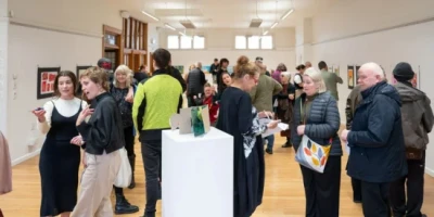 People mingling in The White Room.