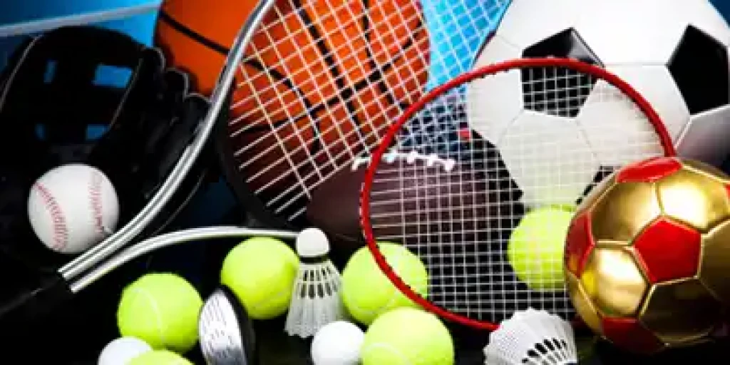 Sports kit filled with tennis rackets, soccer balls, basketball, baseball and badminton shuttles.,