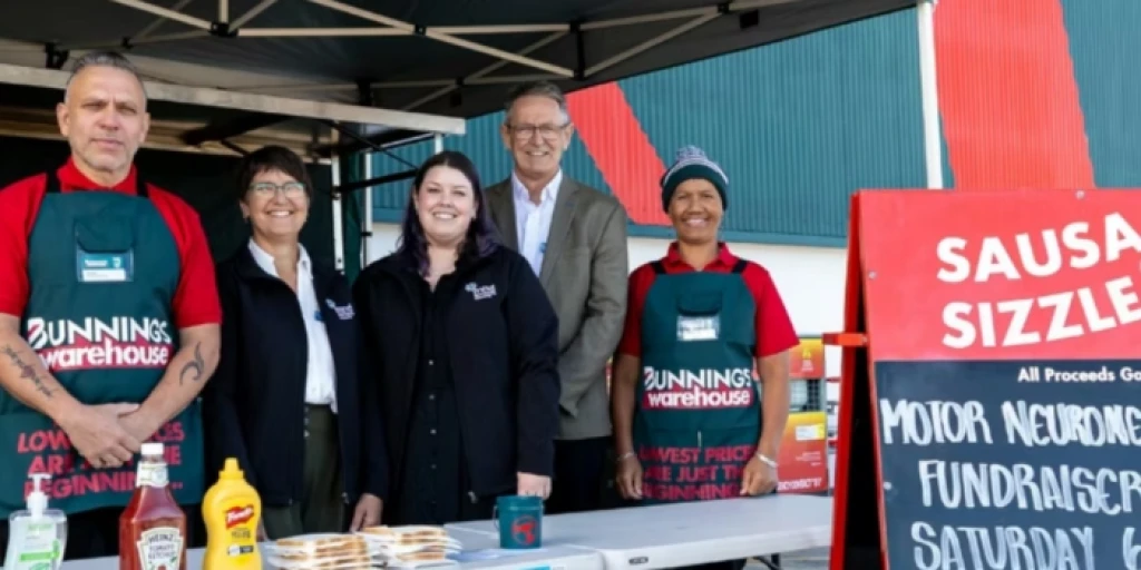 Bunnings and Motor Neurone Disease NZ staff at a sausage sizzle