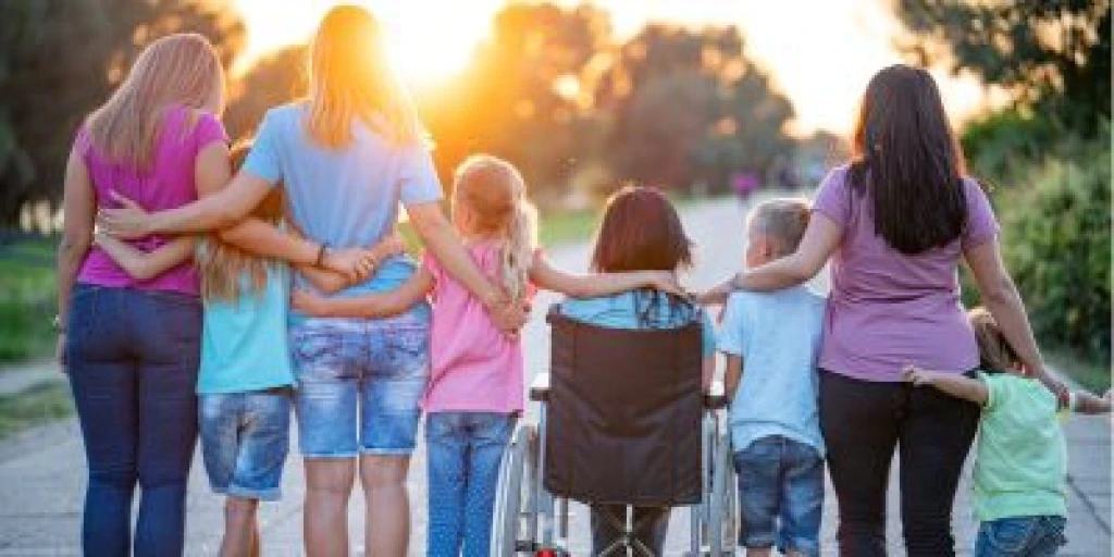 group of women and girls walking with their arms around each other