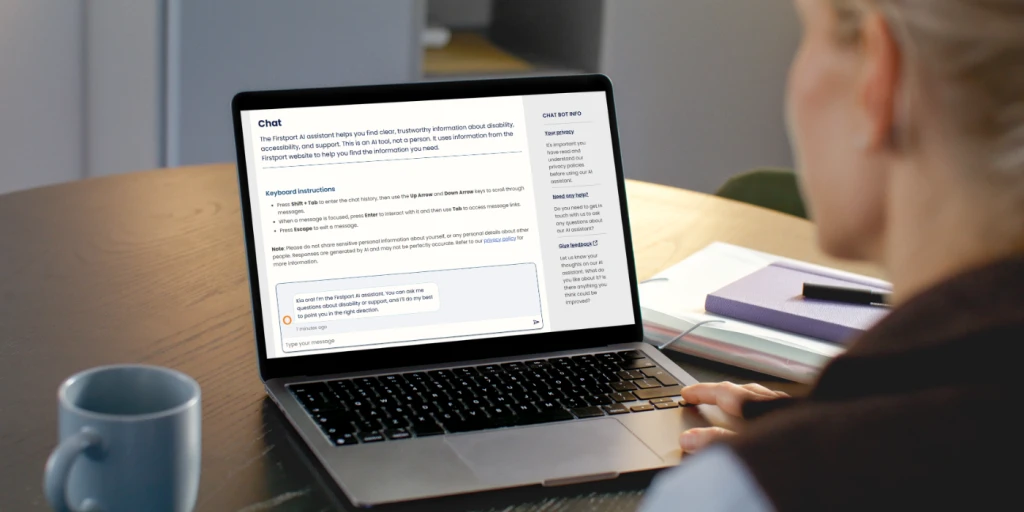 An over the shoulder shot of a woman looking at a laptop with the Firstport AI assistant on the screen