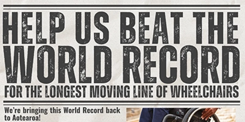 'Help us beat the world record for the longest moving line of wheelchairs' written as a newspaper headline.