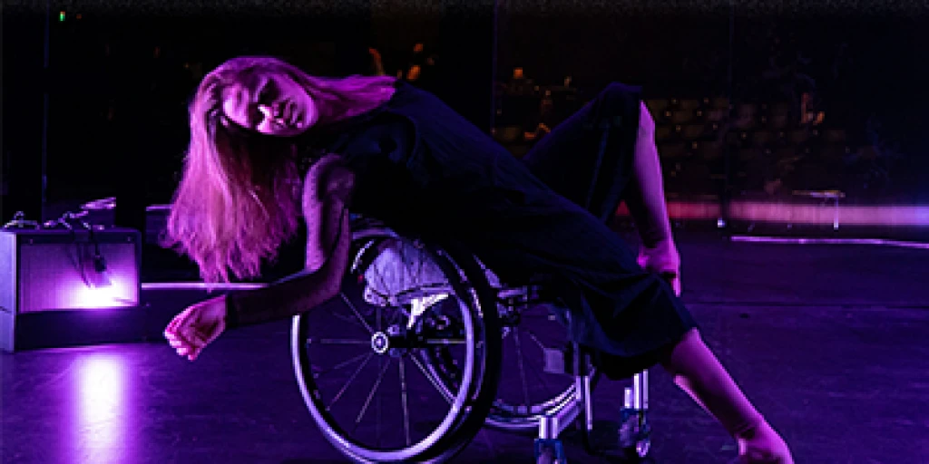 A woman in a wheelchair performing a dance.